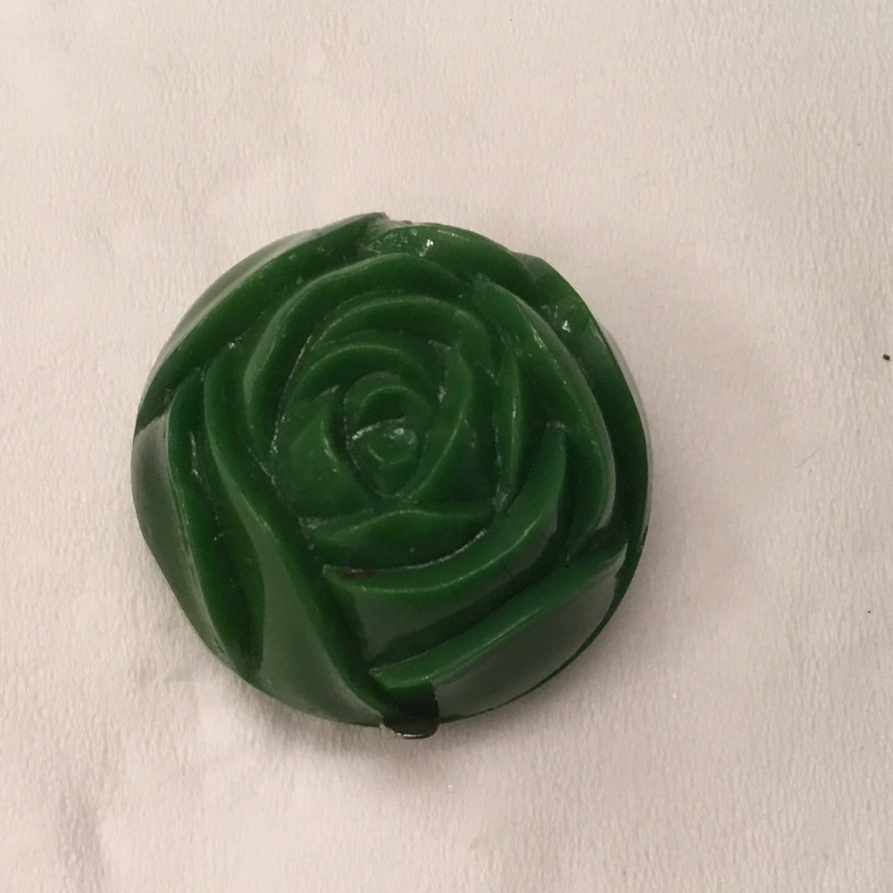 Bakelite Pendent, silver blessed mother on other side.